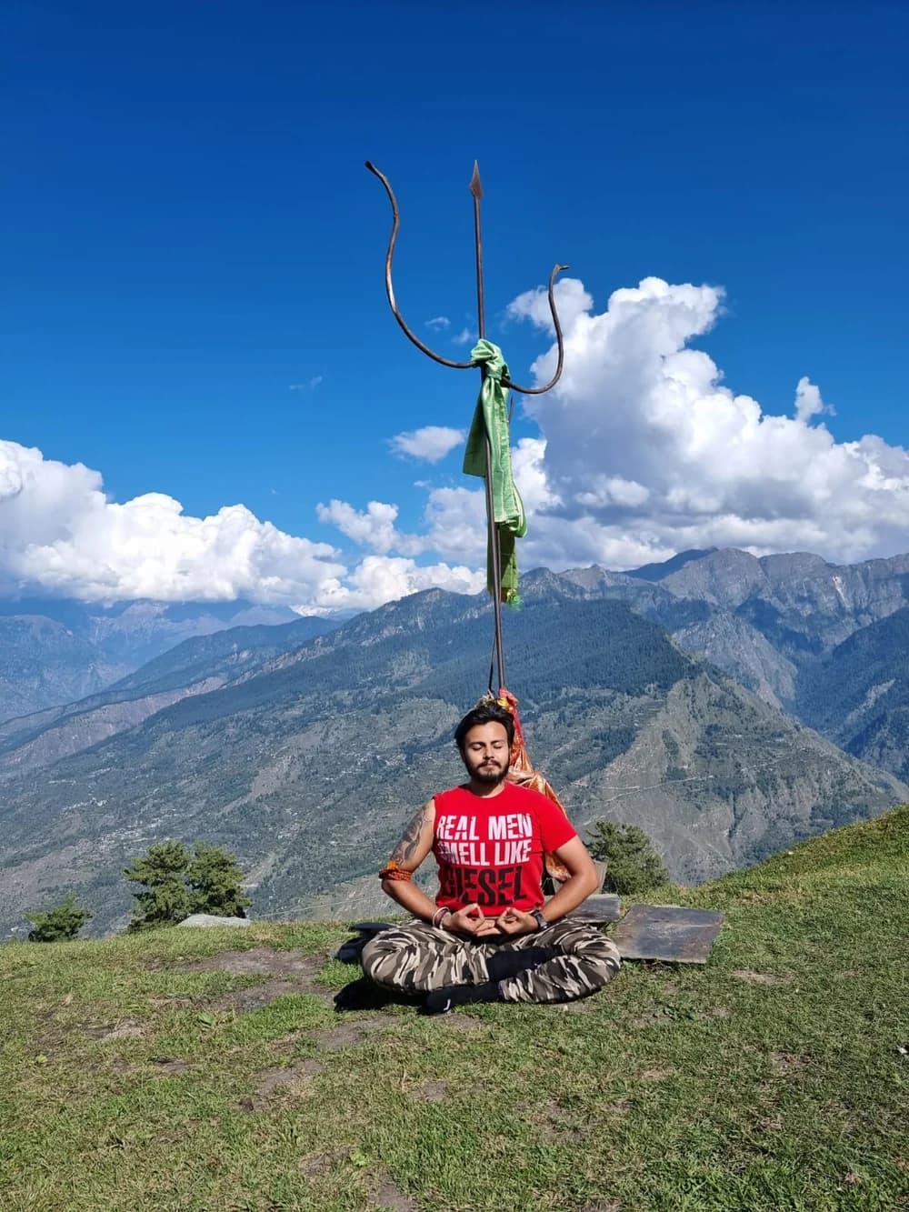 Gandharva meditating beneath a mountain trishul