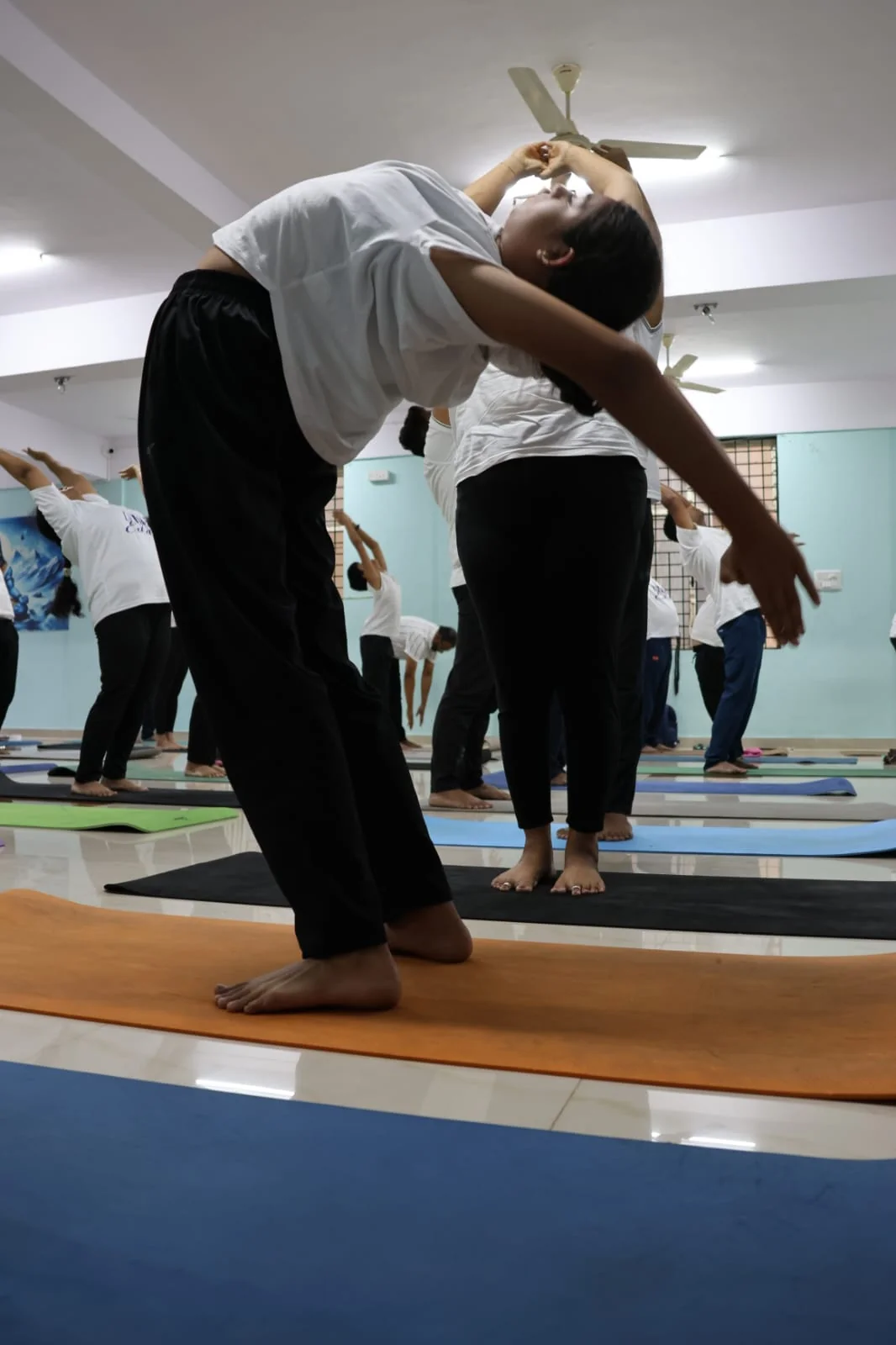 Close-up of a student in a deep backbend stretch